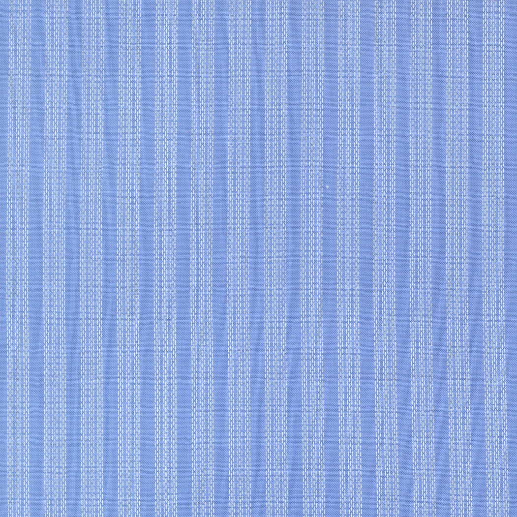 Blue fabric with white verticle stripe pattern
