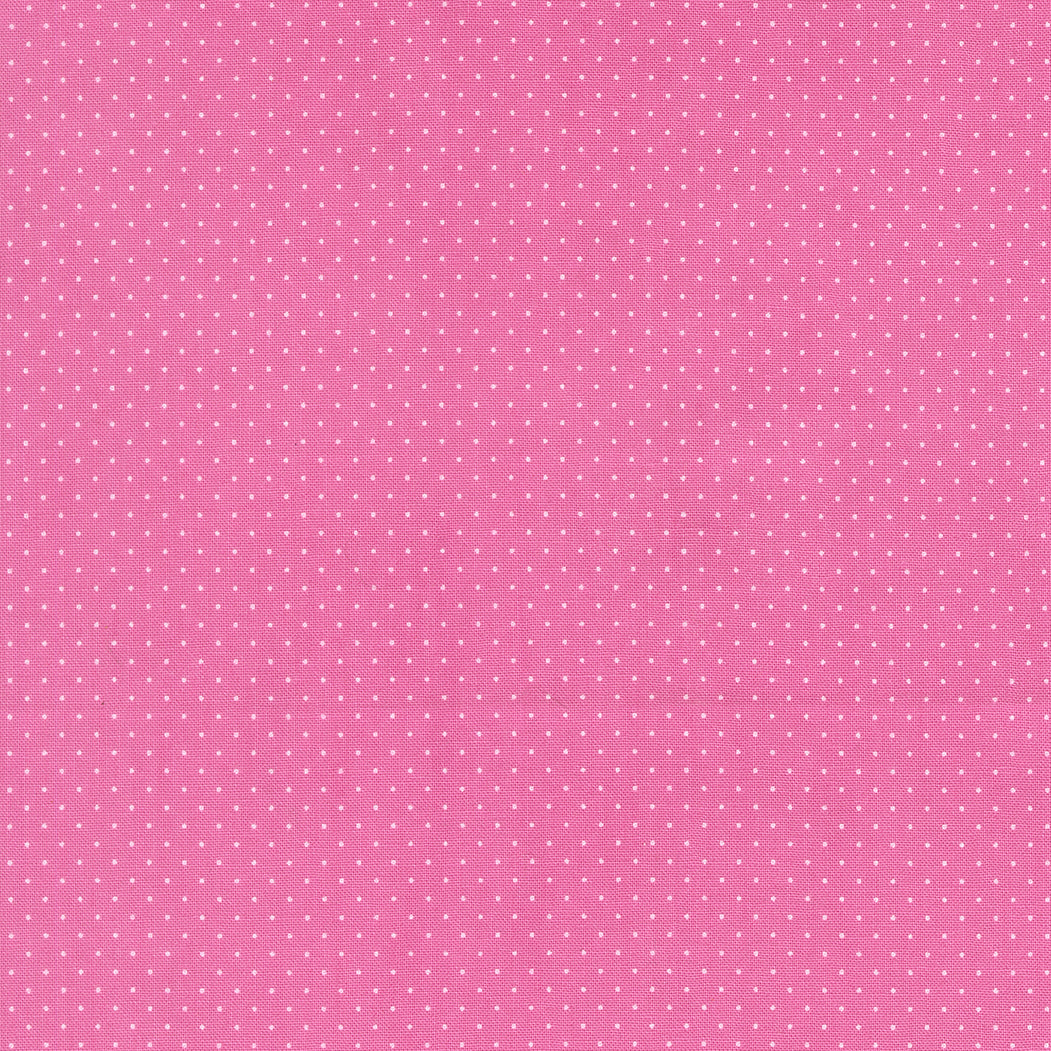 Pink background with small white polka dots