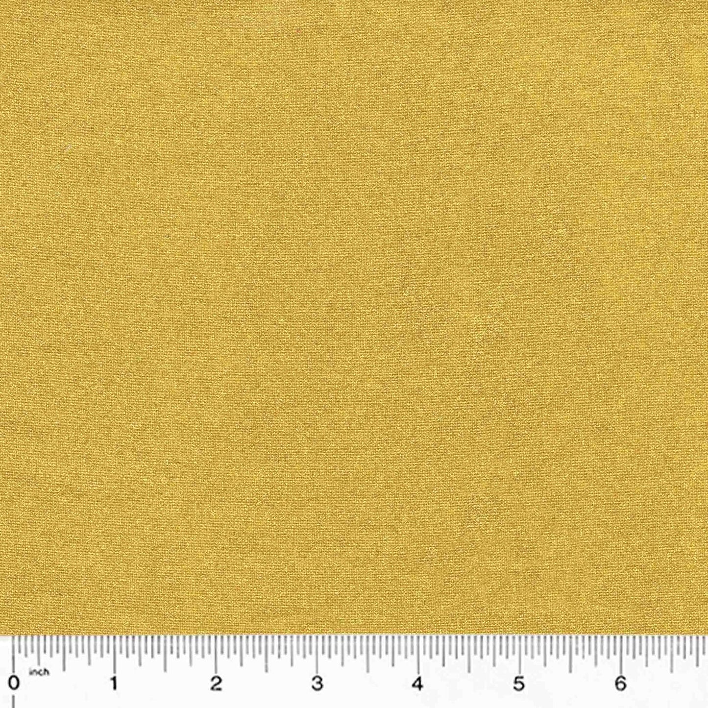gold metallic cotton fabric with a ruler at the bottom for scale.