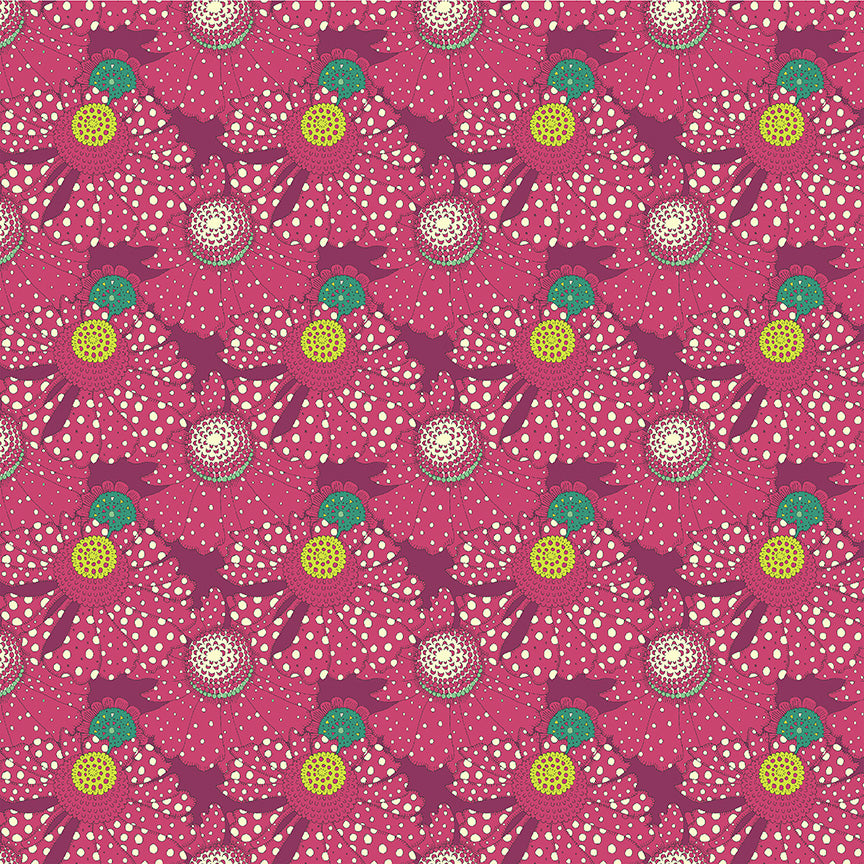 Patterned fabric with colorful design on a pink background