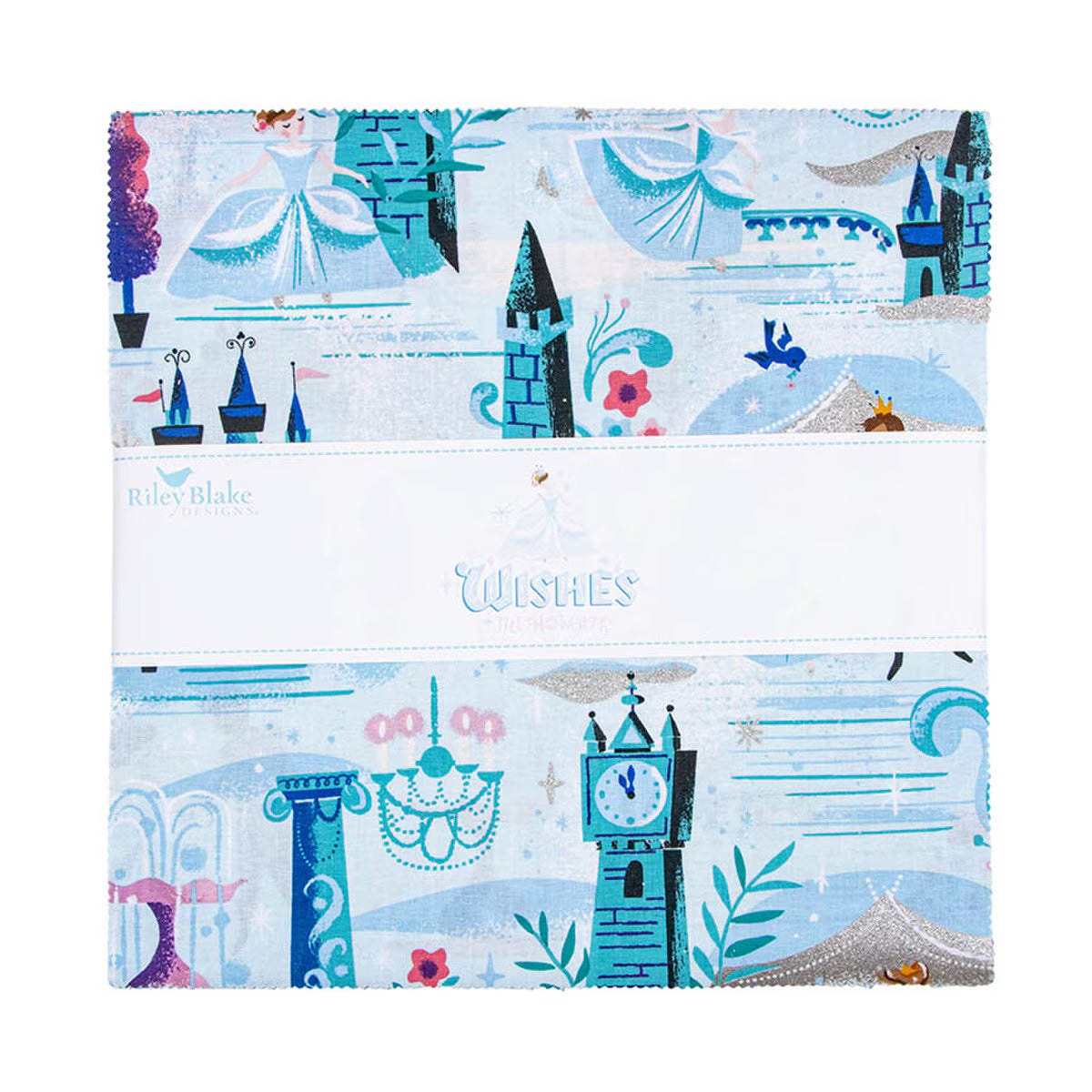 A folded fabric quilt or textile package from Riley Blake Designs, featuring a whimsical fairytale castle and tower pattern in light blue, teal, and white, with a white paper band across the middle reading 'Wishes'.