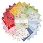 A circular arrangement of multiple fabric squares in assorted floral and patterned designs, with a white paper band across the center reading 'Dear Sweethearts'.