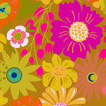 A vibrant retro floral pattern featuring bold magenta, yellow, orange, and pink flowers with whimsical details like a smiling face and a crescent moon, set against a warm mustard brown background.