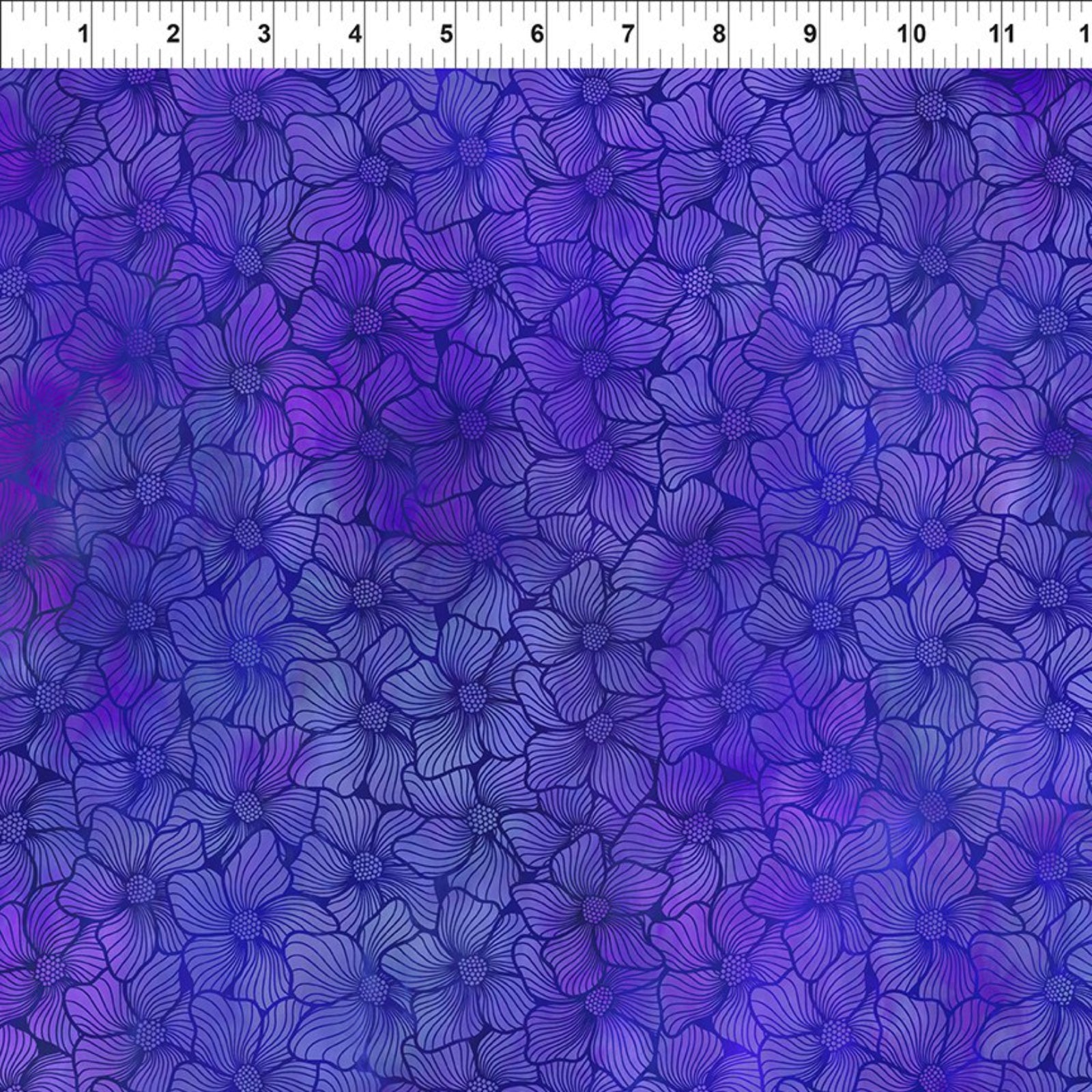 Blue floral pattern fabric swatch with a ruler at the top