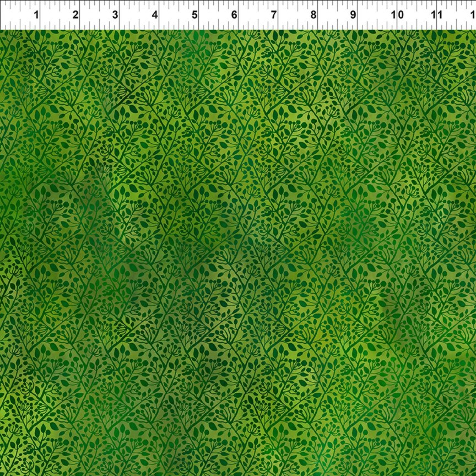 Green patterned fabric with a white ruler at the top