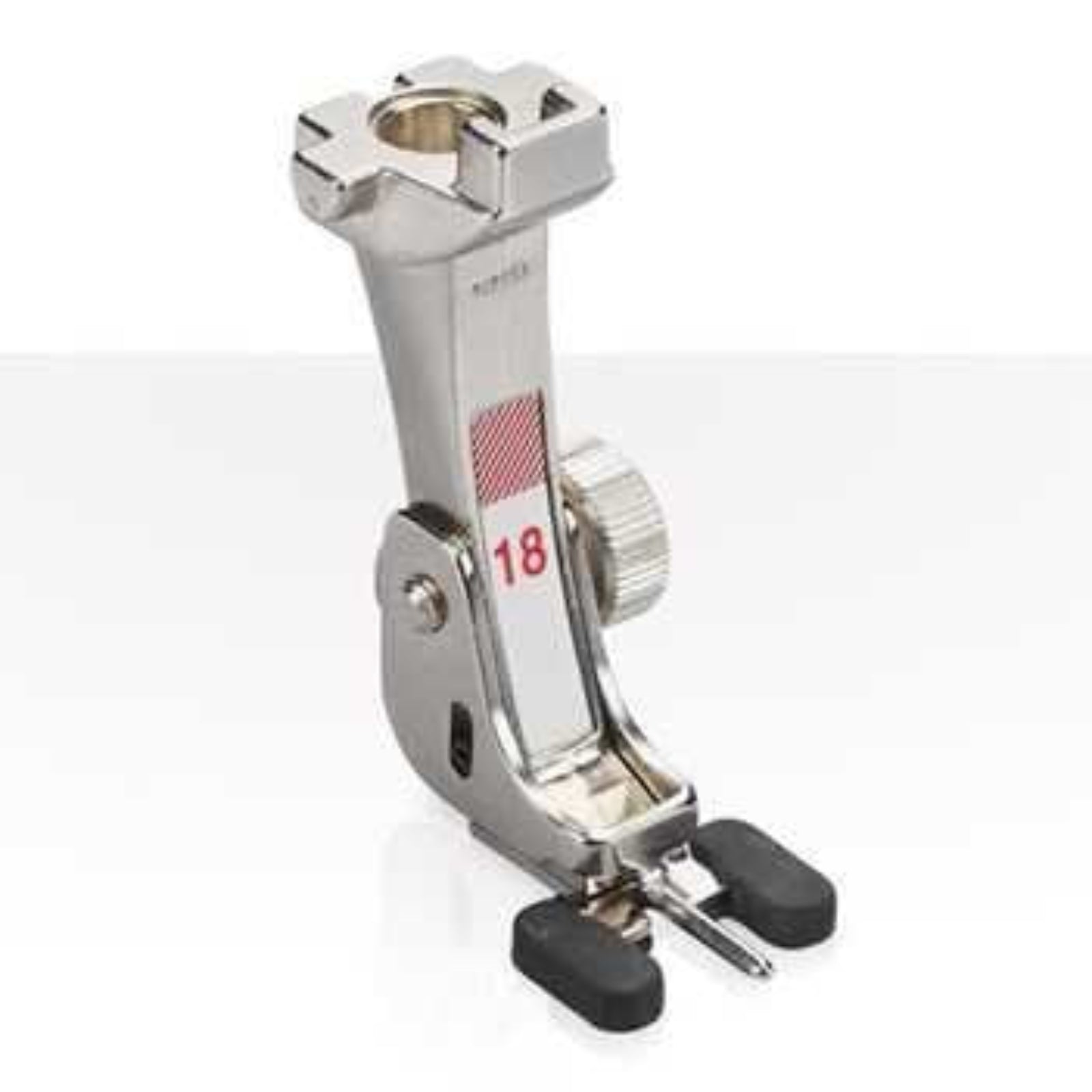 Metal sewing machine presser foot on a white background
