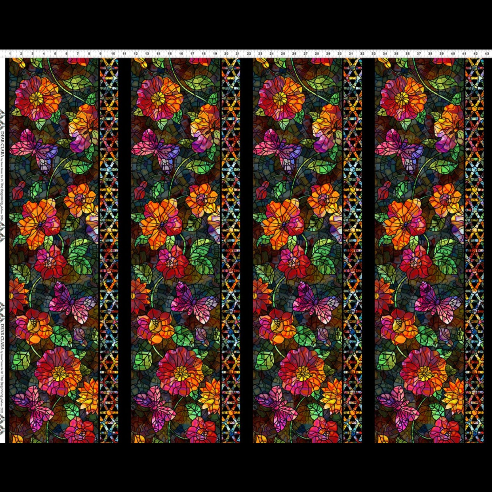 A repeating stained-glass-style floral pattern with large orange, red, purple, pink, and green flowers on a dark background, shown as a fabric or print swatch with a ruler scale along the top and left edge.