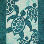 Appliqué quilt featuring five stylized sea turtles in dark teal on a lighter aqua background.