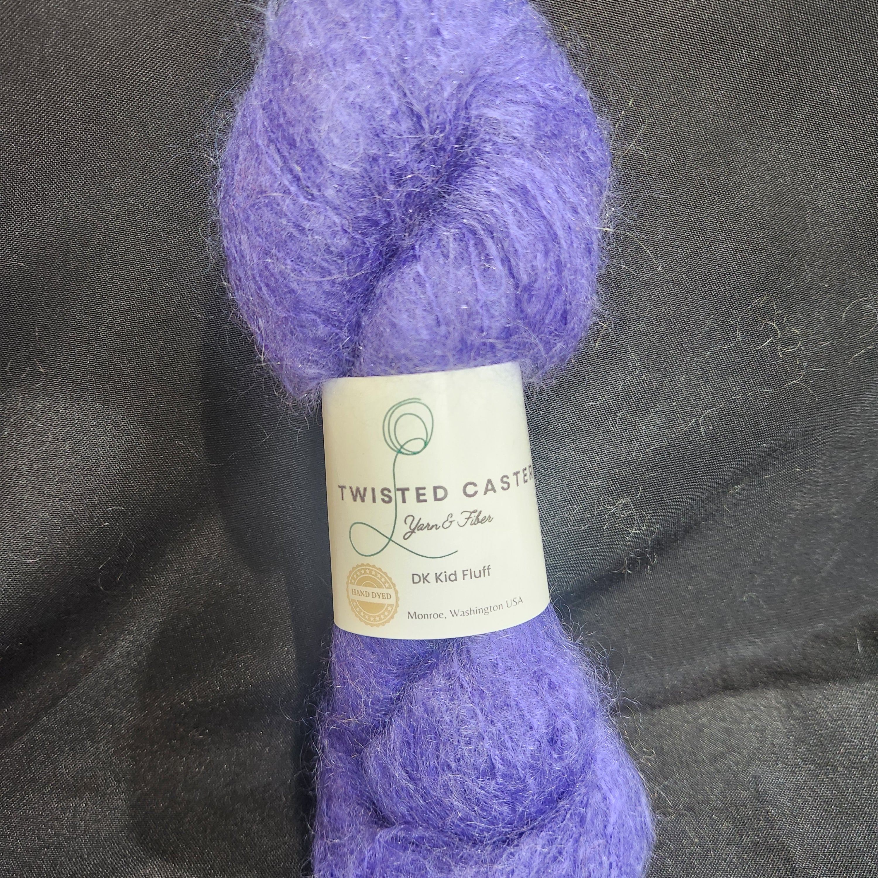 A skein of fluffy lavender purple yarn 