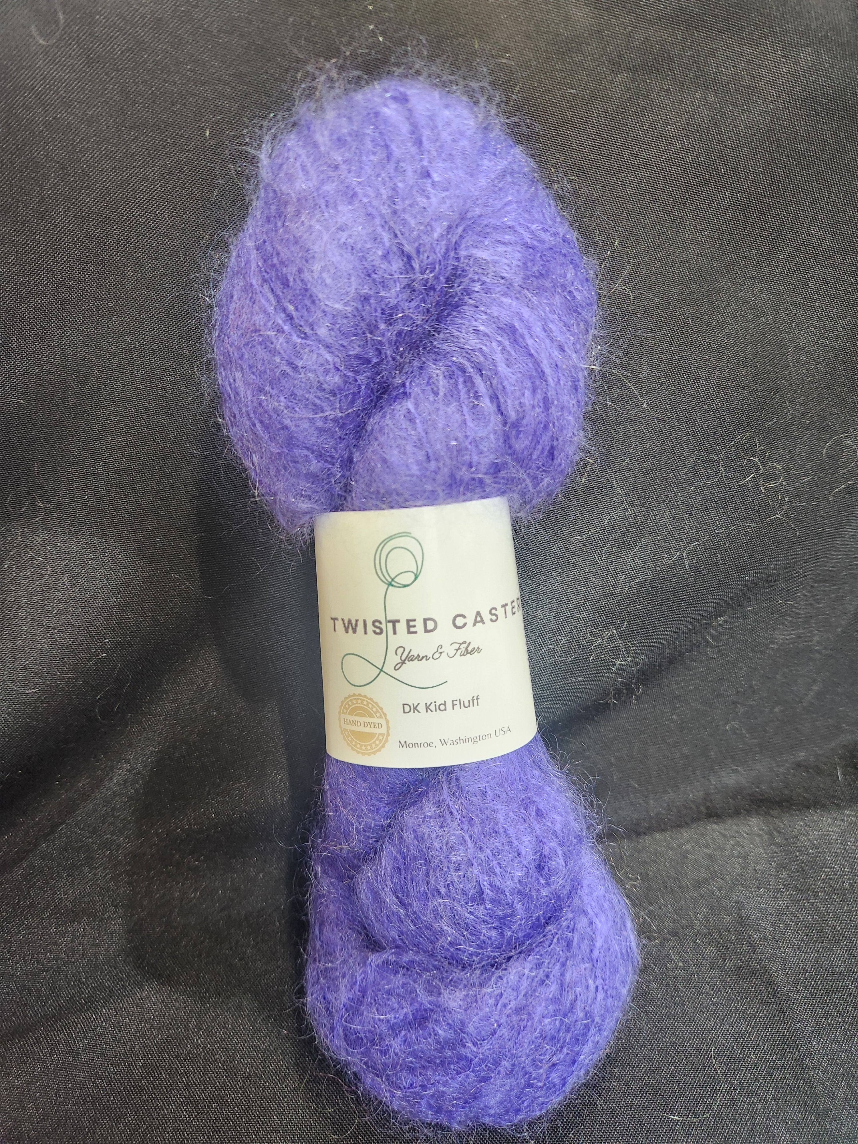 A skein of fluffy lavender purple yarn 