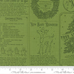 Green fabric with Christmas-themed designs, text, and a ruler at the bottom.