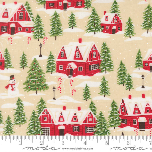 Christmas-themed fabric pattern with red houses, green trees, and snowmen on a beige background, featuring a ruler for scale.