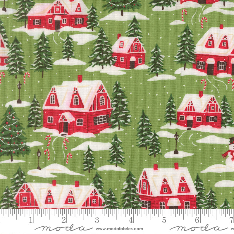 Christmas-themed fabric with red houses, trees, and candy canes on a green background.