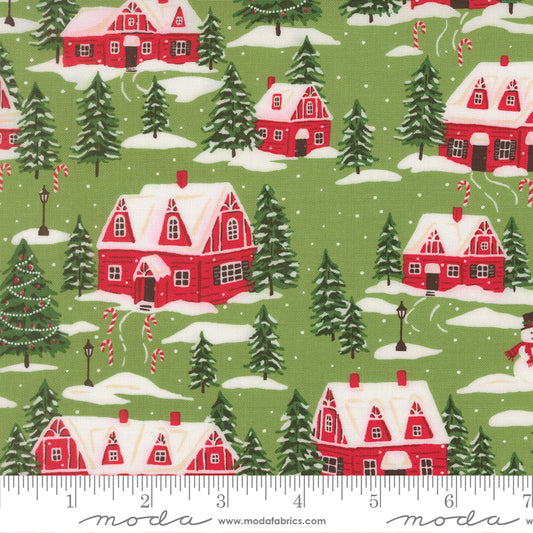 Christmas-themed fabric with red houses, trees, and candy canes on a green background.