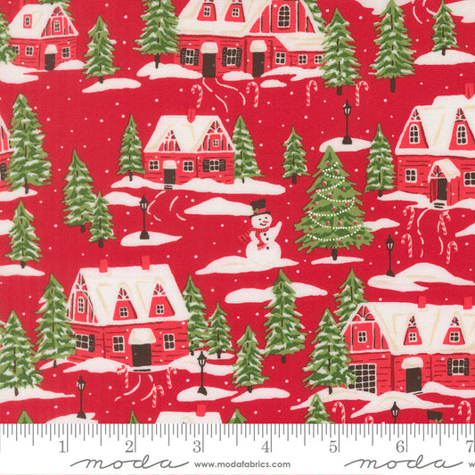 Christmas-themed fabric pattern with houses, trees, and a snowman on a red background, featuring a ruler at the bottom.