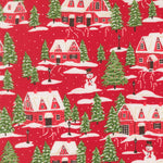 Christmas-themed fabric pattern with red houses, green trees, and snowmen on a red background.
