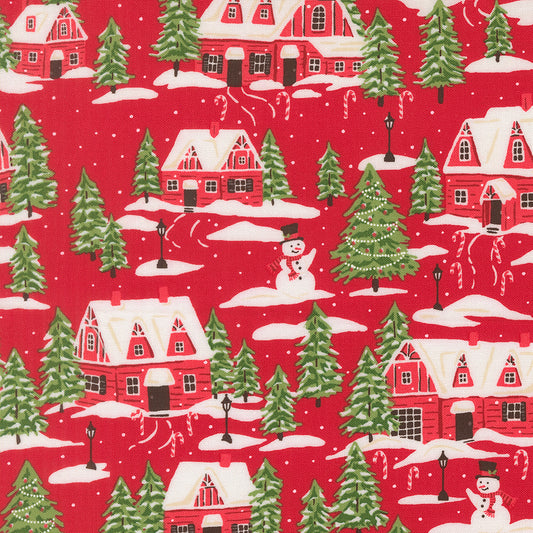 Christmas-themed fabric pattern with red houses, green trees, and snowmen on a red background.