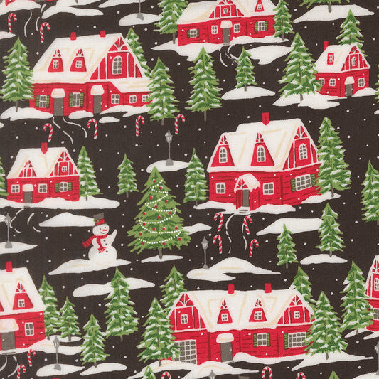 Christmas-themed fabric pattern with red houses, green trees, and snowmen on a black background.