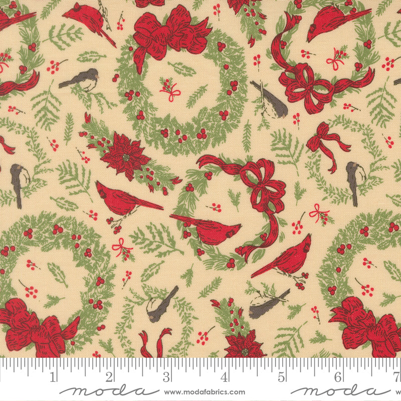 Christmas-themed fabric pattern with red cardinals, green wreaths, and red bows on a beige background, featuring a ruler for scale.