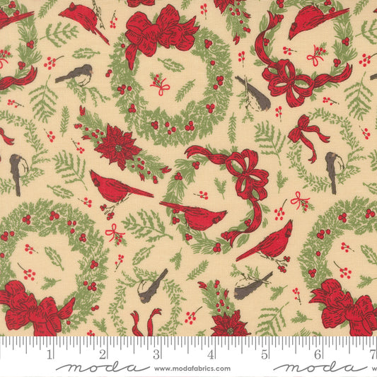 Christmas-themed fabric pattern with red cardinals, green wreaths, and red bows on a beige background, featuring a ruler for scale.