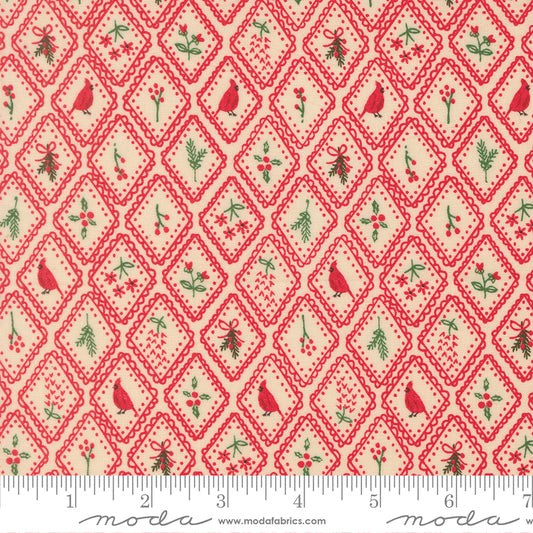 Christmas-themed fabric pattern with red birds, green holly leaves, and red diamonds on a beige background, featuring a ruler for scale.