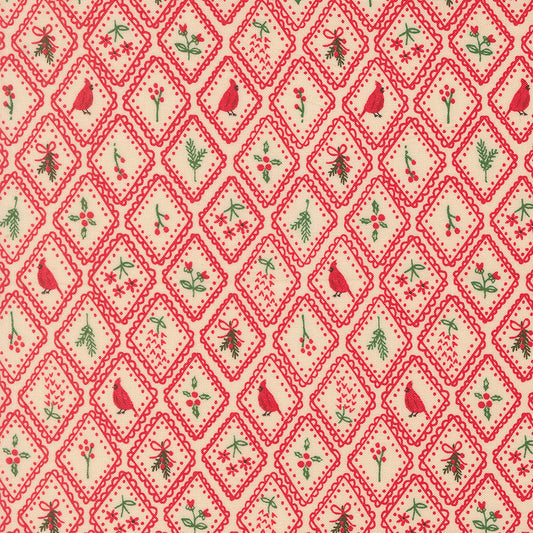 Patterned fabric with red and green design on a beige background