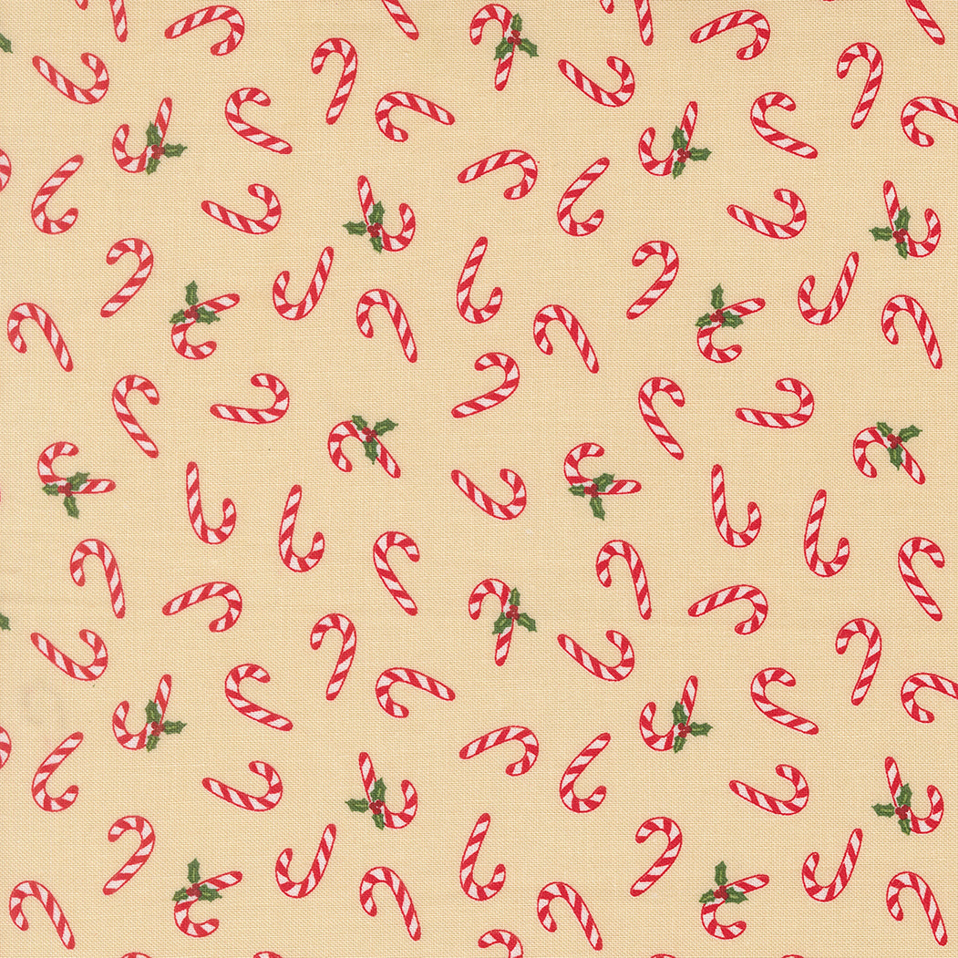 Pattern of red and white candy canes with green leaves on a beige background