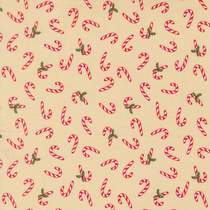 Pattern of red and white candy canes with green leaves on a beige background