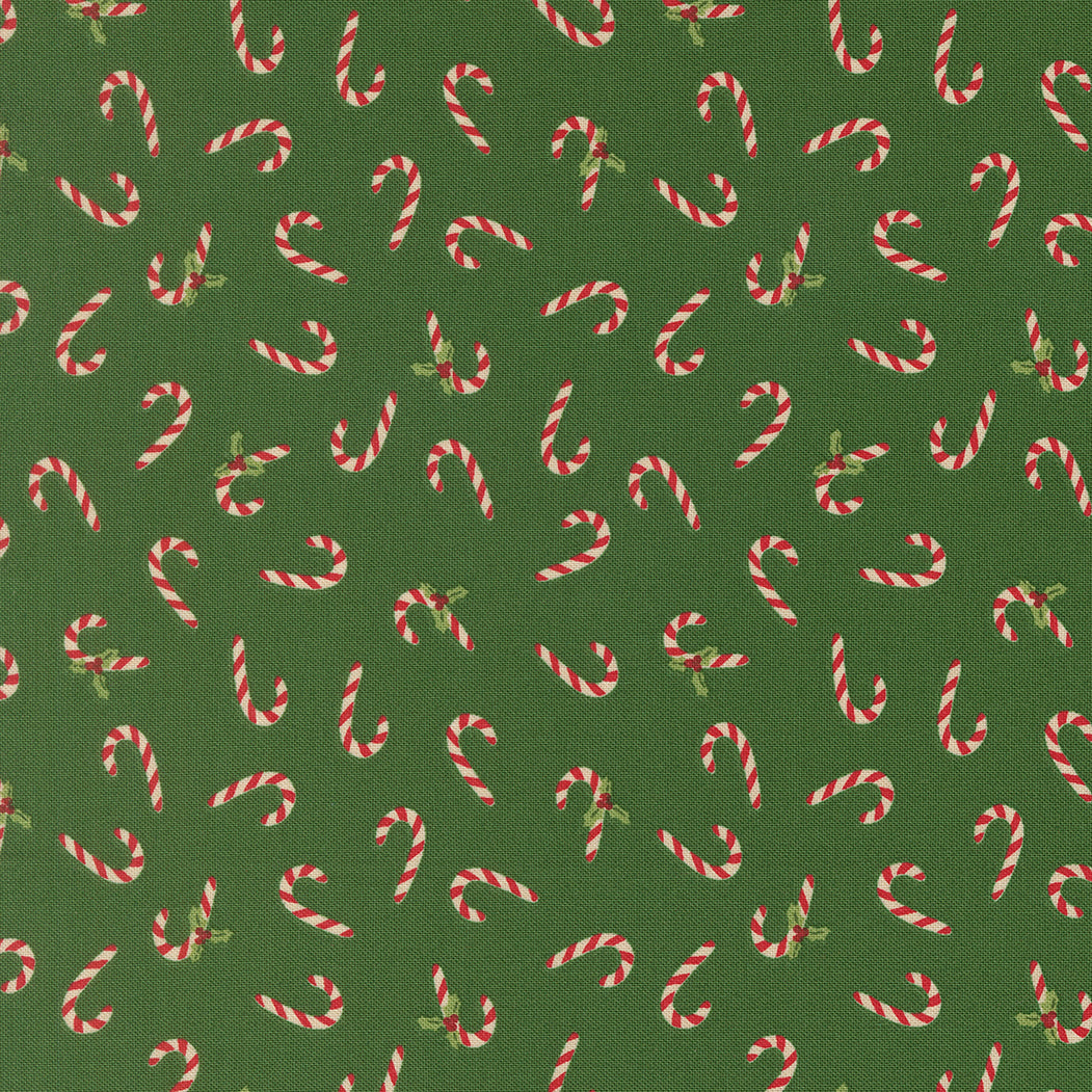 Pattern of candy canes on a green background