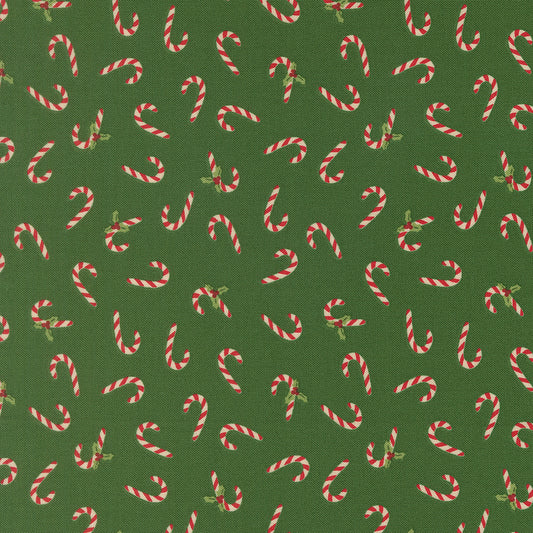 Pattern of candy canes on a green background