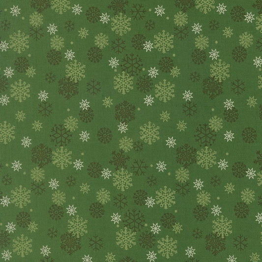Pattern of snowflakes on a green background