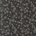 Pattern of snowflakes on a dark background