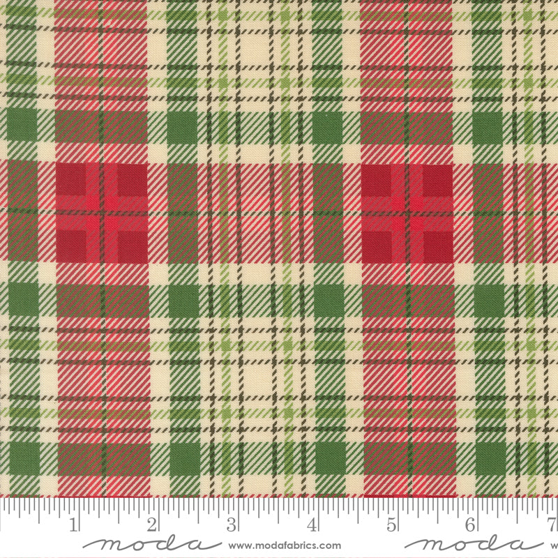 Plaid fabric pattern with red, green, and beige colors, featuring a ruler for scale.
