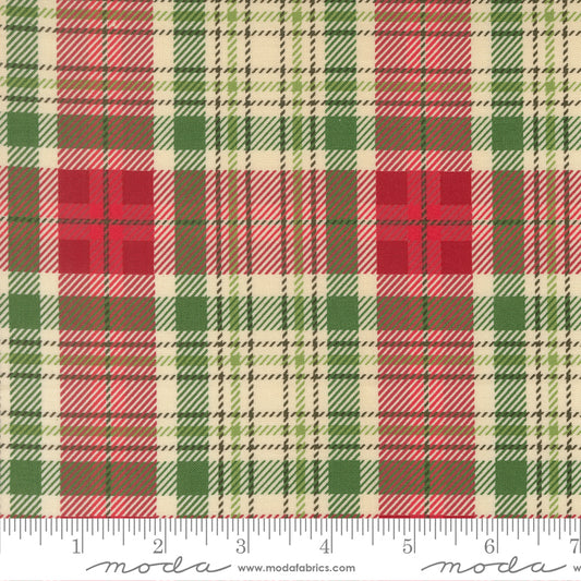 Plaid fabric pattern with red, green, and beige colors, featuring a ruler for scale.