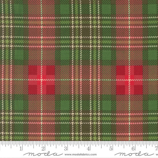 Plaid fabric pattern with red, green, and brown colors, featuring a ruler at the bottom for scale.