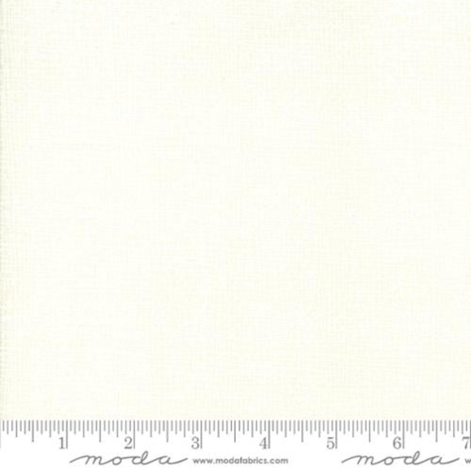 White fabric swatch with a ruler at the bottom for scale, featuring the Moda Fabrics logo.