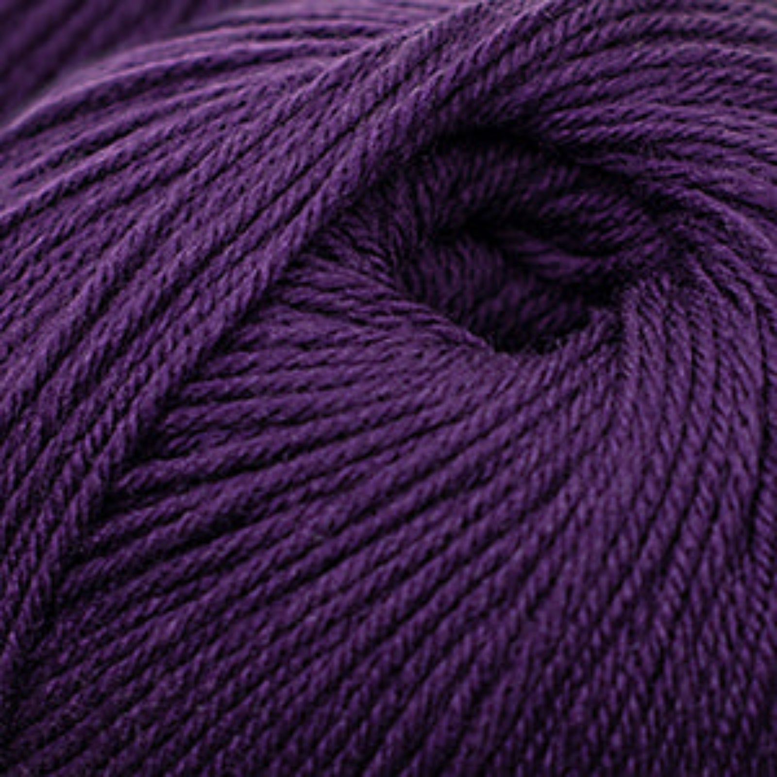 Close-up of a ball of purple yarn