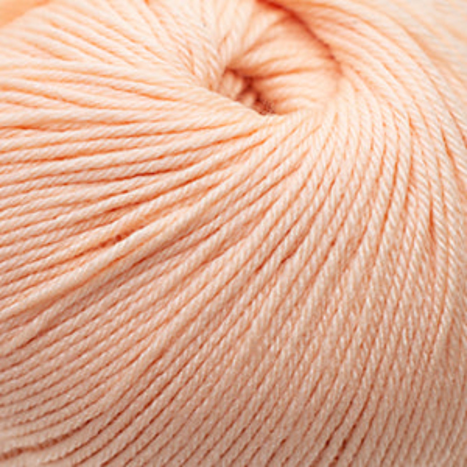 Close-up of a ball of light pink yarn