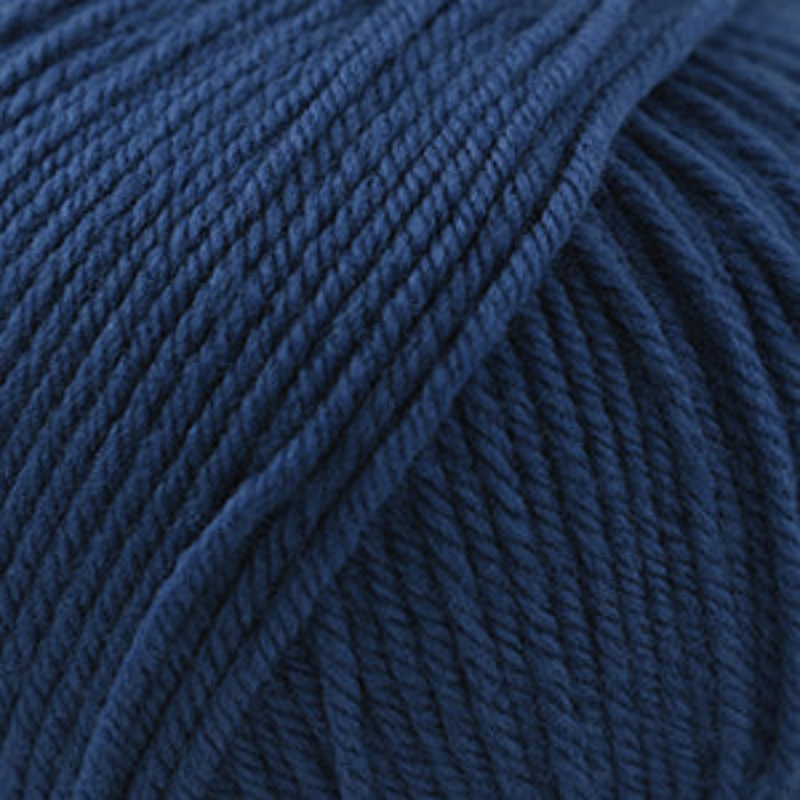 Close-up of a ball of dark blue yarn