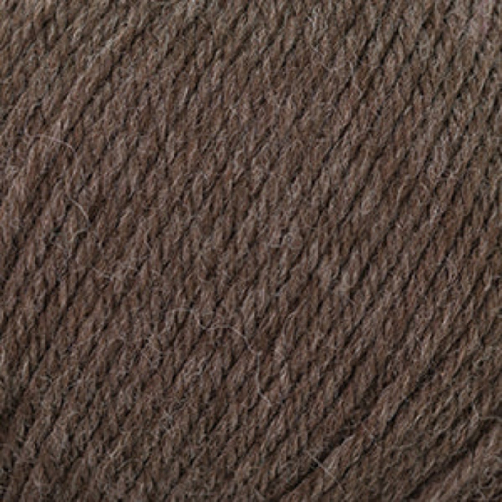 A close-up texture shot of dark brown yarn, showing the twisted ply structure and fine fibers.