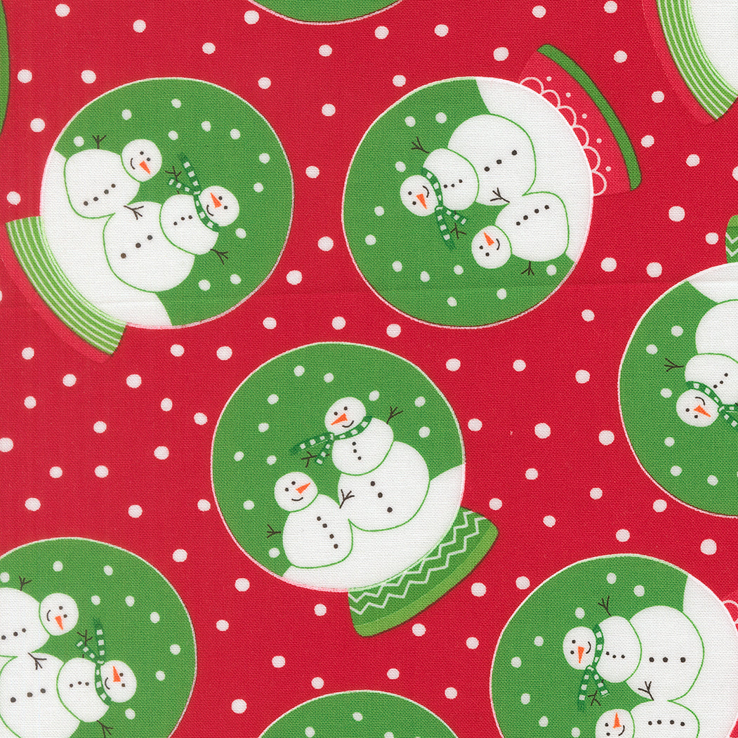 Pattern of snowmen on green plates with a red background and white polka dots