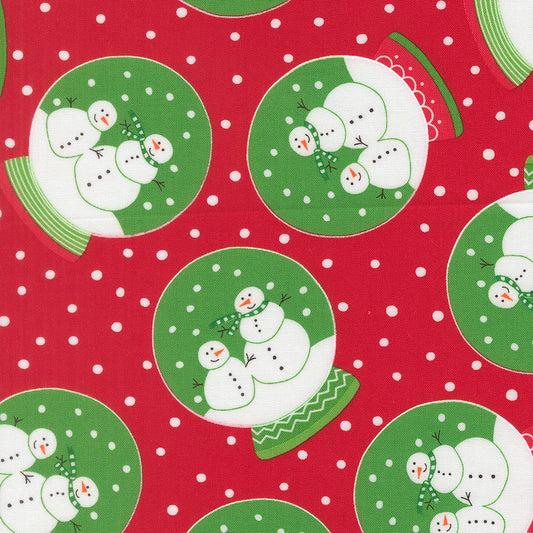 Pattern of snowmen on green plates with a red background and white polka dots