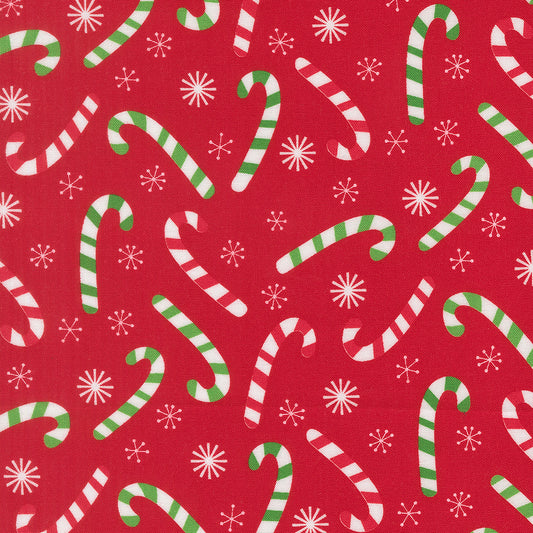 Pattern of candy canes and snowflakes on a red background
