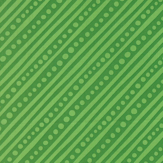 Green pattern with diagonal stripes and small dots on a green background