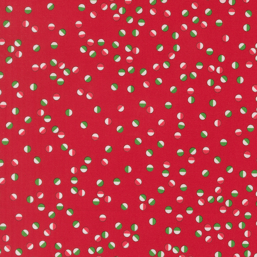 Red fabric with green and white polka dot pattern
