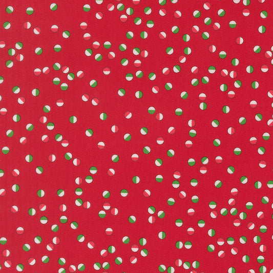 Red fabric with green and white polka dot pattern
