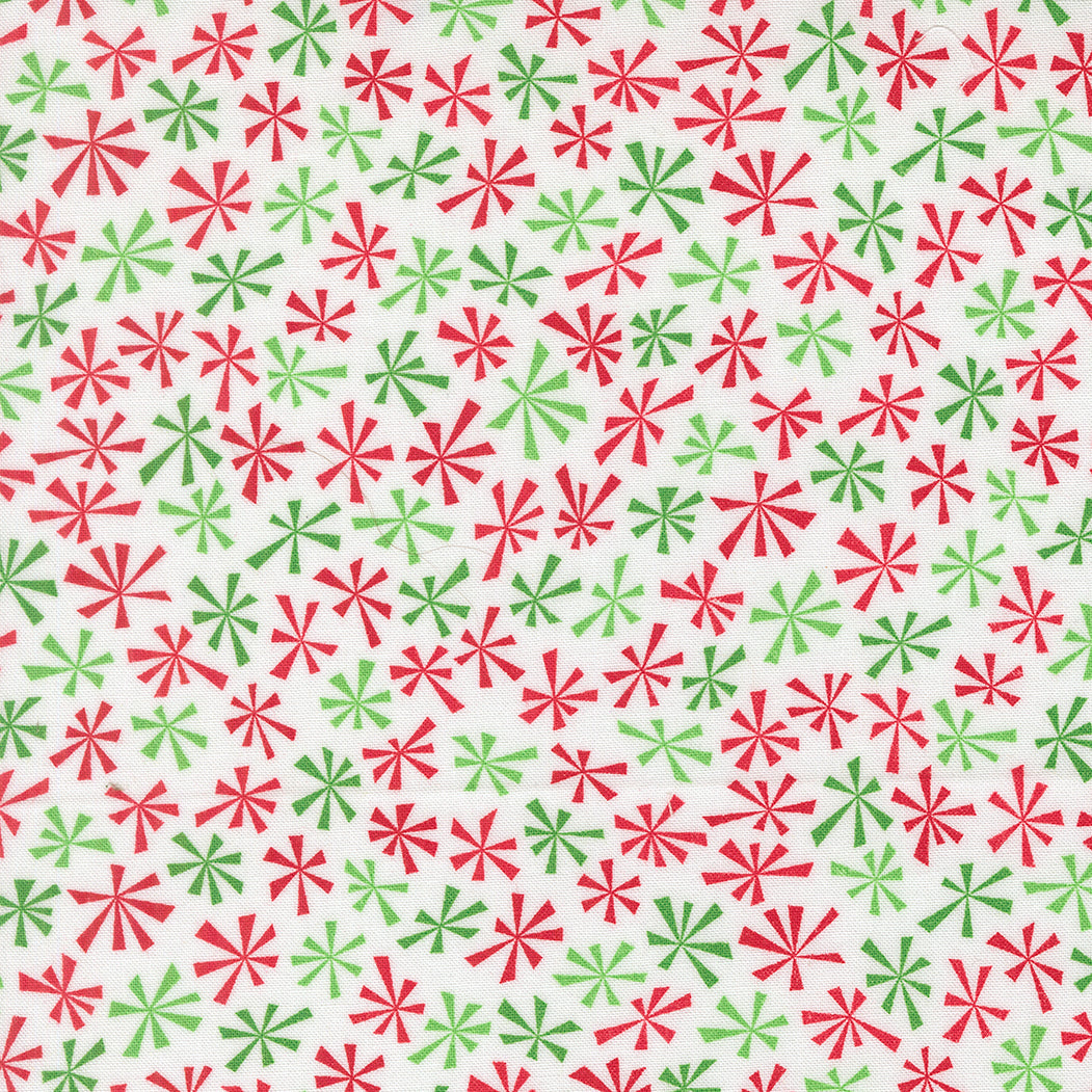 Pattern of red and green stars on a white background