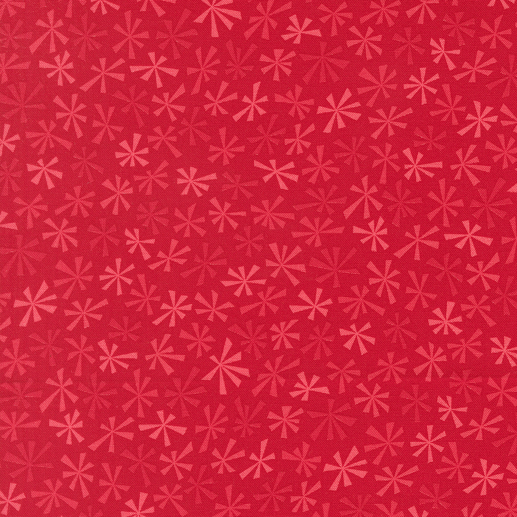 Red pattern with pink geometric shapes on a red background