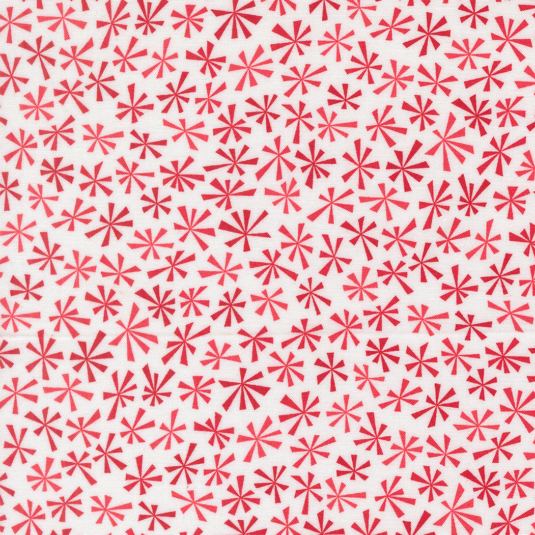 Pattern of red star shapes on a white background