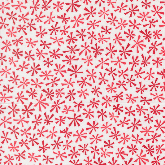 Pattern of red star shapes on a white background